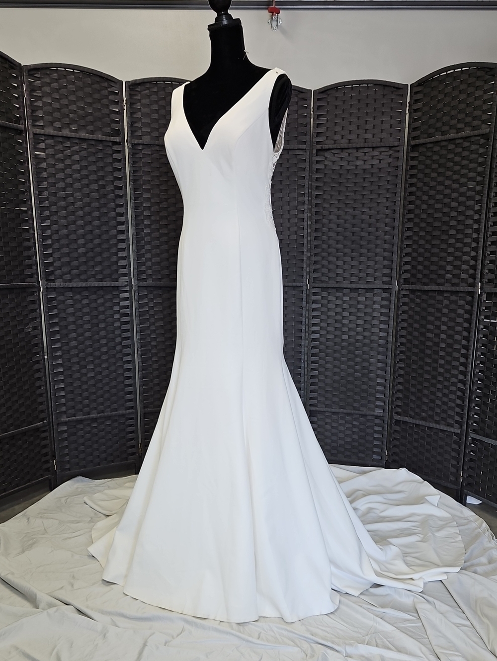Size 12 ivory sleek trumpet bridal gown w/ deep V-neckline & beaded open backNWT